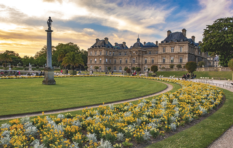 The picturesque Jardin du Luxembourg, featuring the Medici Fountain, flowers, and people enjoying the park.